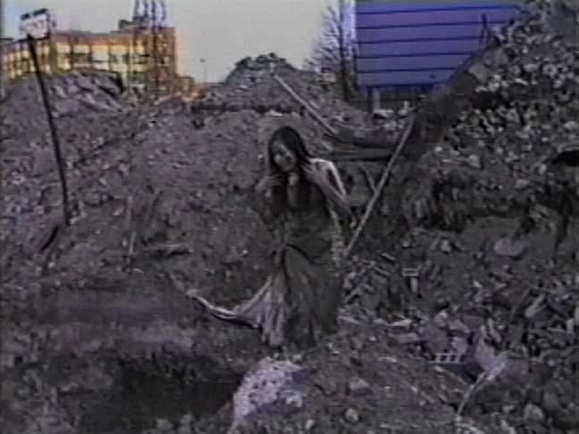 'toxic soil' live artwork for video (video still) - performance art by contemporary Plains Cree artist Jude Norris